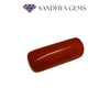 Natural red coral gemstone, polished oval shape, on white background