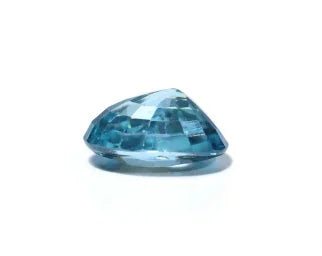 Natural blue gemstone, faceted and oval-shaped, displayed on a white background