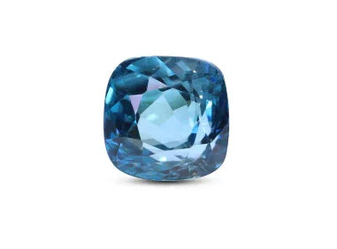 cushion-cut blue gemstone with brilliant facets on white background