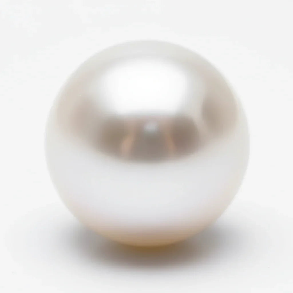 Natural white pearl gemstone with smooth, lustrous surface on a plain background